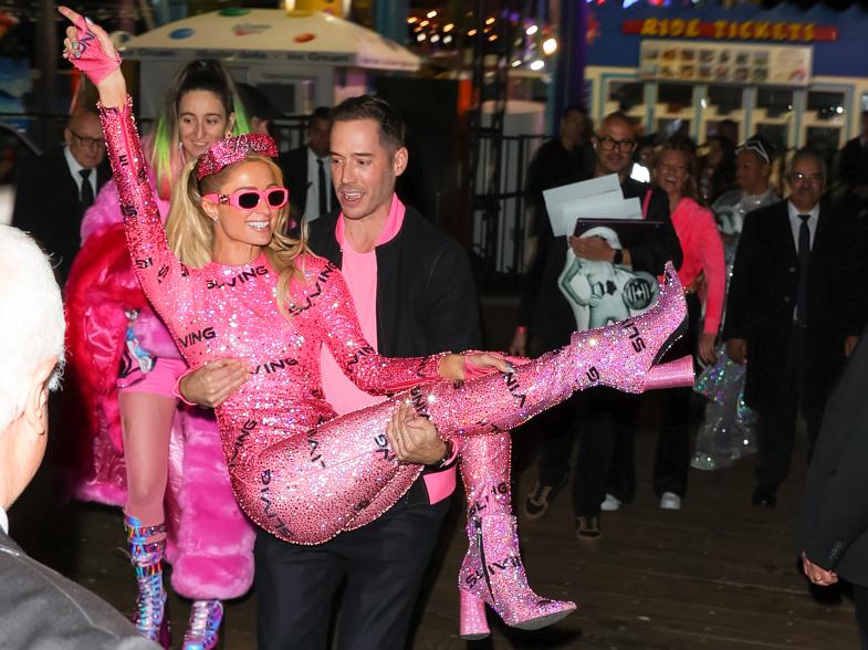 Paris Hilton gets carried by Carter Reum
