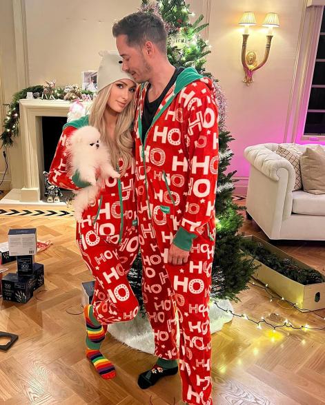 Paris Hilton and Carter Reum match in Christmas pajamas