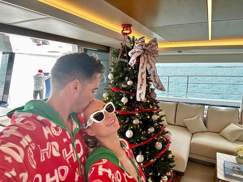 Paris Hilton and Carter Reum match in Christmas pajamas