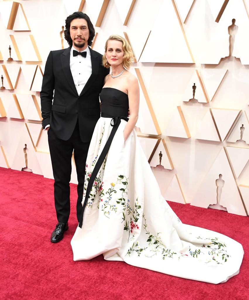 Suited Adam Driver poses with Joanne Tucker on red carpet