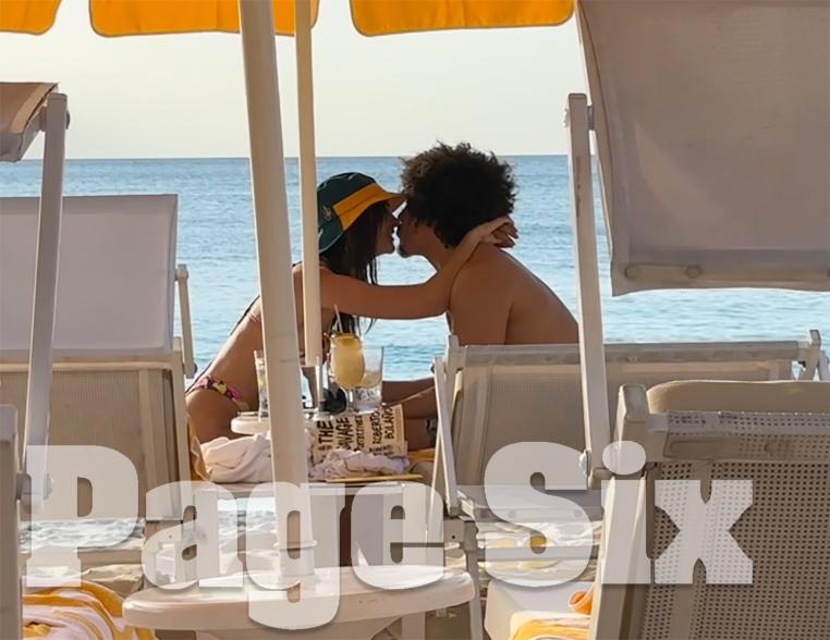 Emily Ratajkowski and Eric André kissing on the beach on Grand Cayman