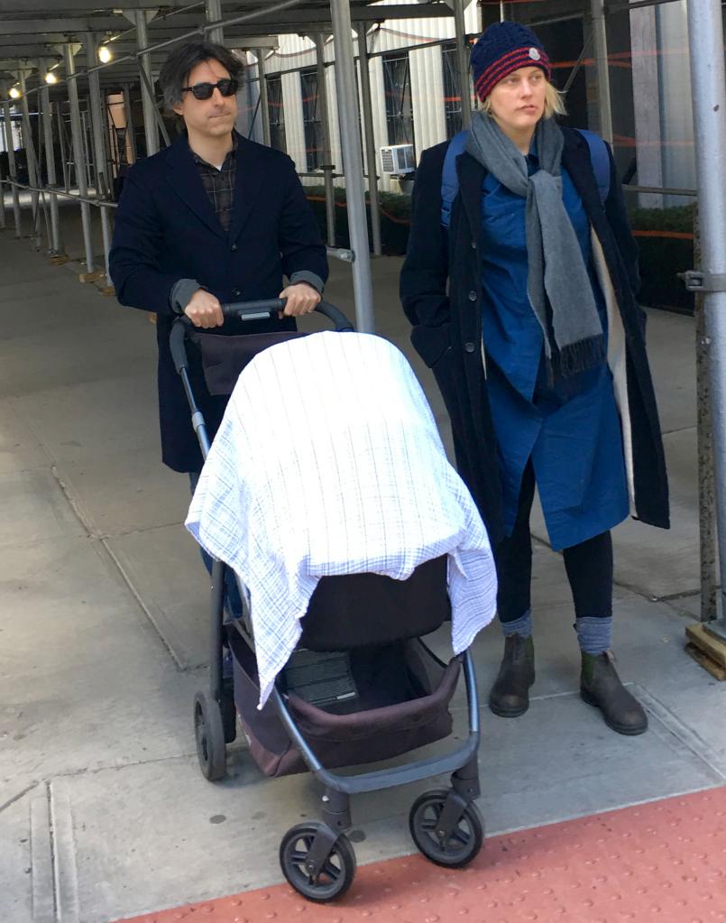 Greta Gerwig walks beside Noah Baumbach pushing son Harold in a stroller