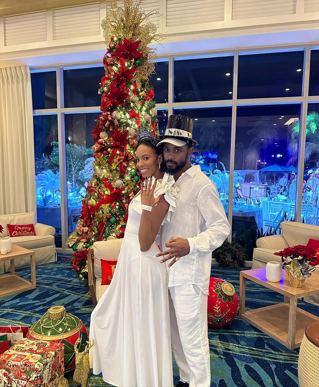 LaKeith Stanfield poses with his fiancée, Kasmere Trice, as she shows off her engagement ring.