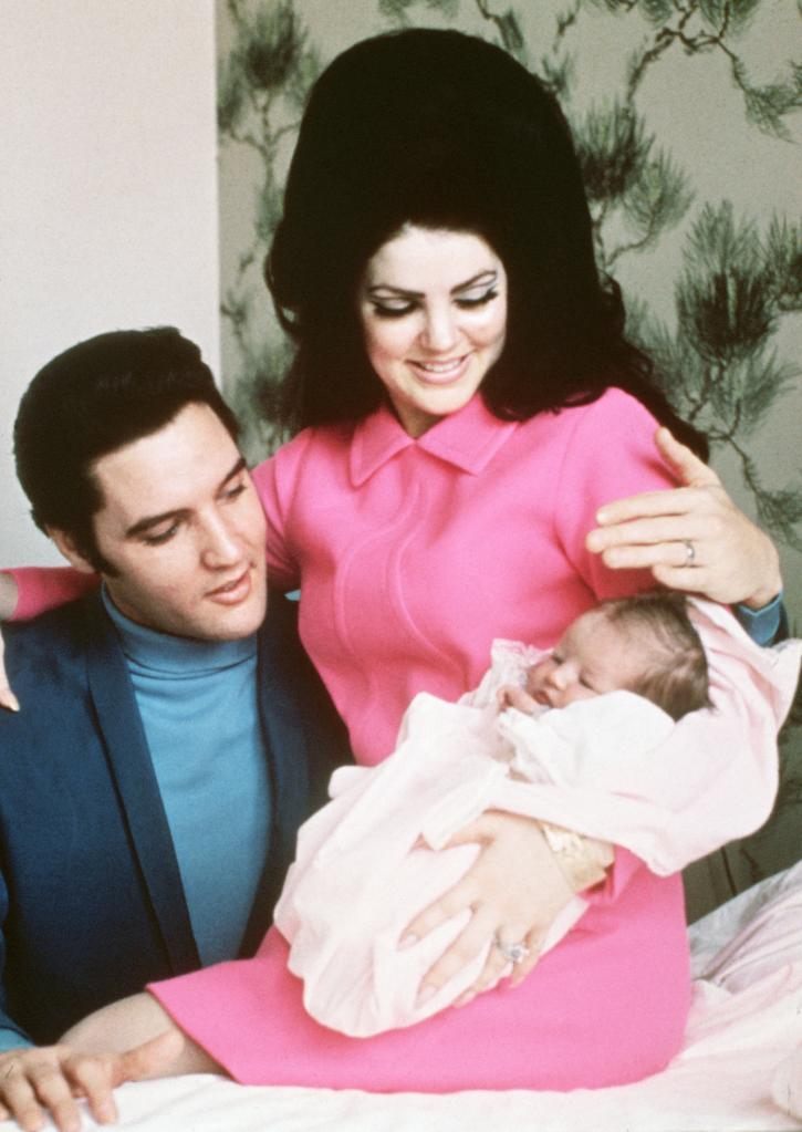 Elvis Presley and Priscilla Presley with baby Lisa Marie Presley.