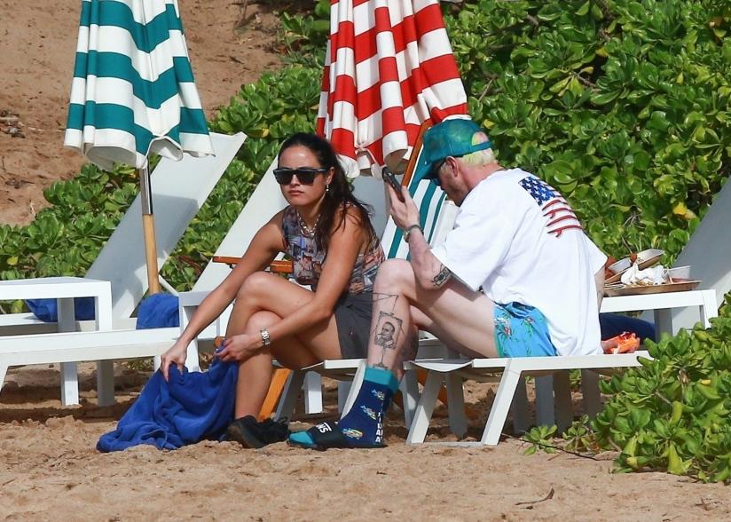 Chase Sui Wonders and Pete Davidson talking on the beach.