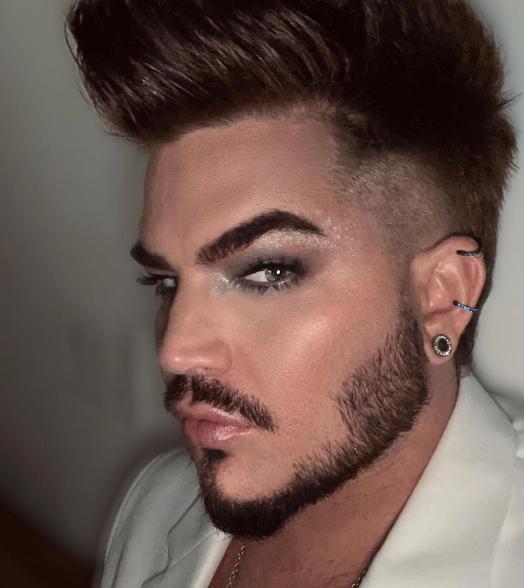 A selfie of Adam Lambert wearing makeup.