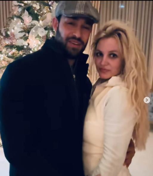 Britney Spears and Sam Asghari posing together.