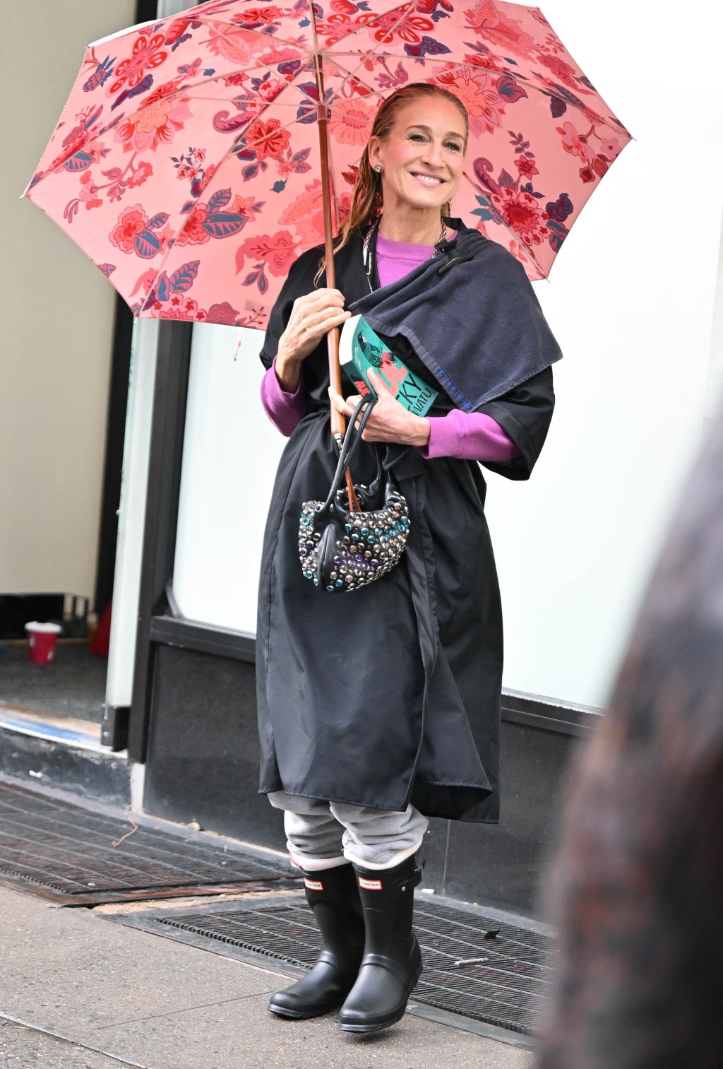 Sarah Jessica Parker boots carrying an umbrella