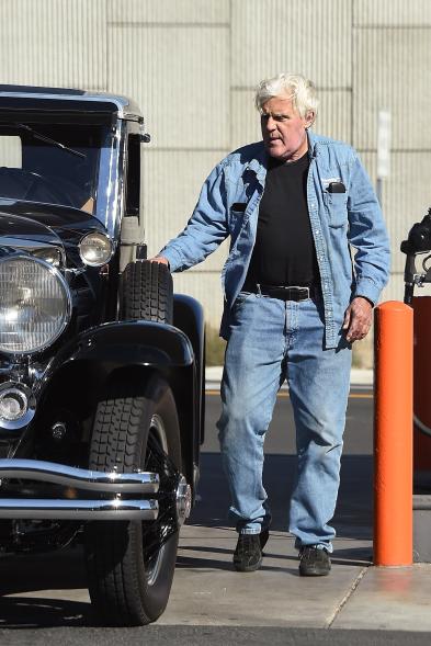 Jay Leno getting into his car.