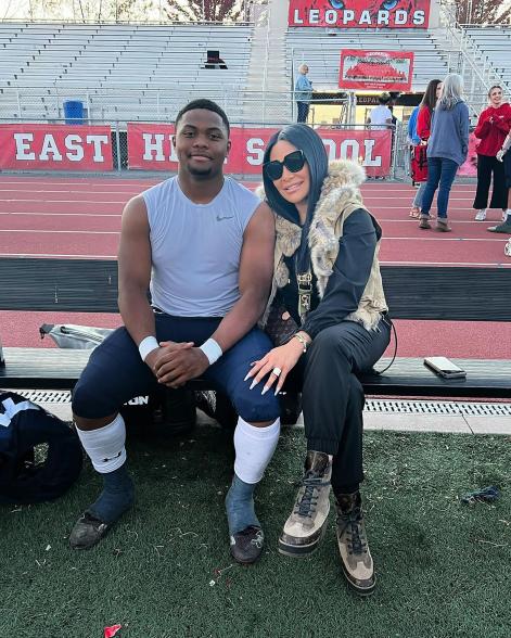 Jen Shah and her son posing for a photo together