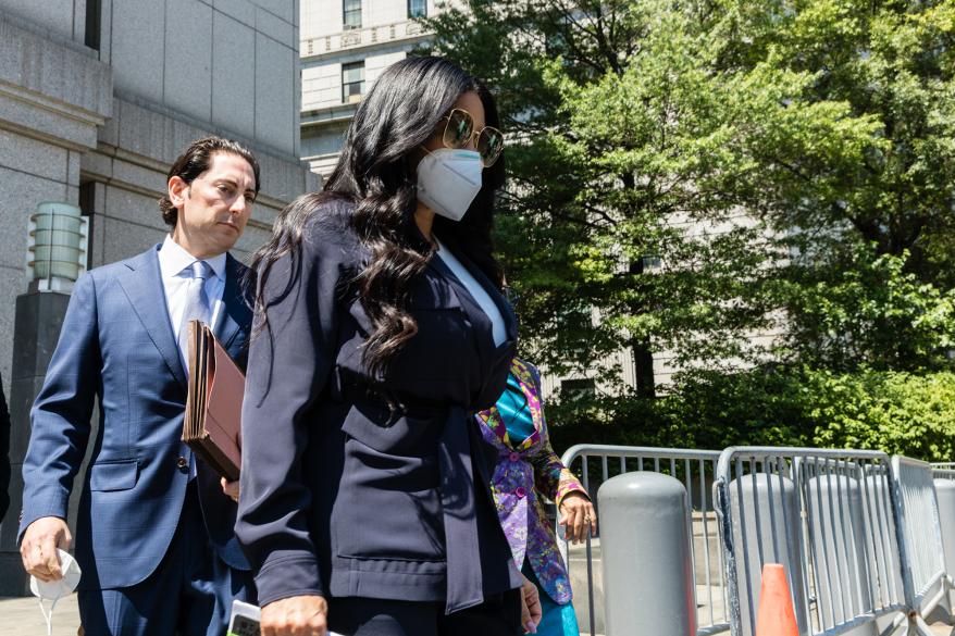 Jen Shah walking outside of a courthouse with a mask on.
