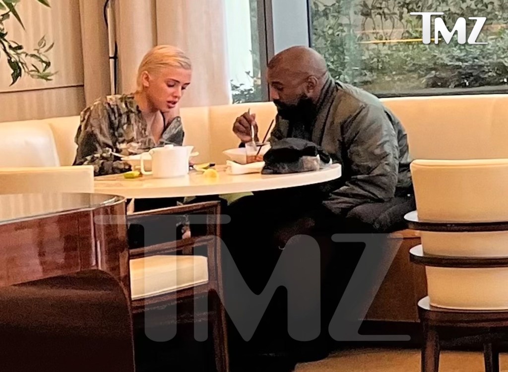 Kanye West and a mystery blonde dining together.