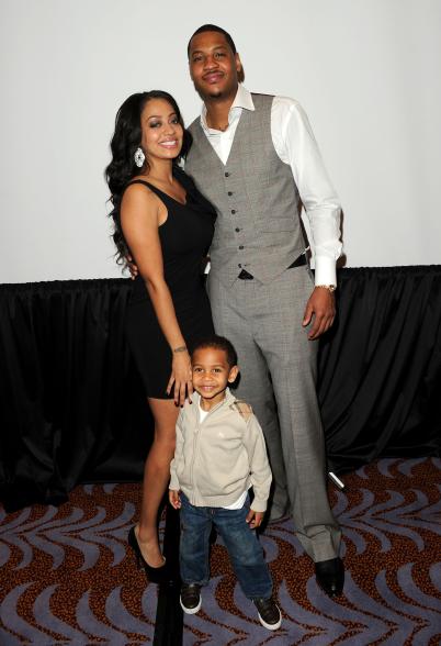 La La Anthony, Carmelo Anthony and their son, Kiyan, posing together.