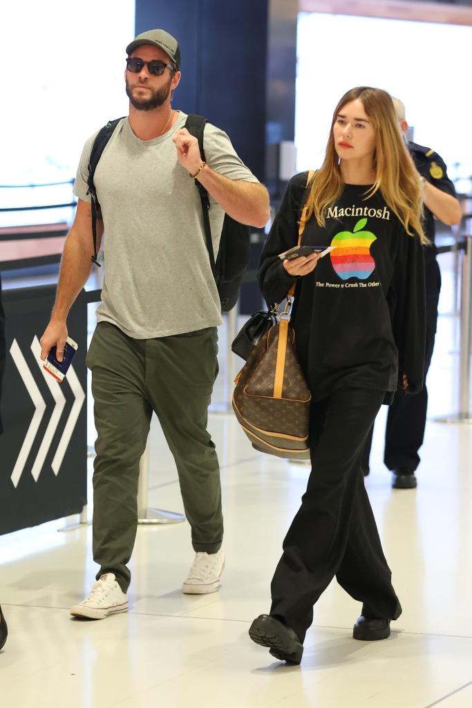 Liam Hemsworth and Gabriella Brooks in the airport.