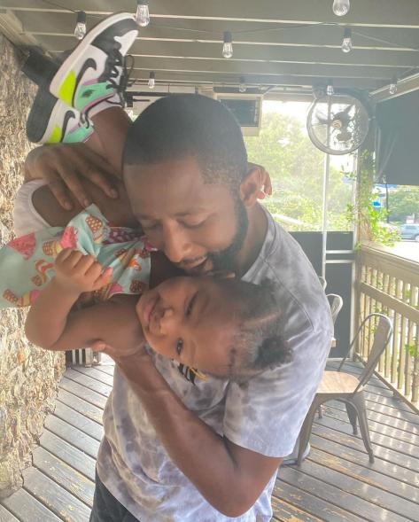 Brandon Smiley kisses his daughter