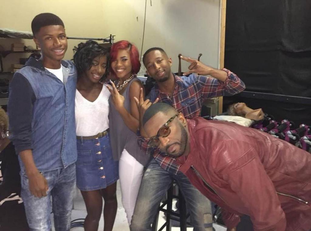 Rickey Smiley's son Brandon Smiley poses with loved ones