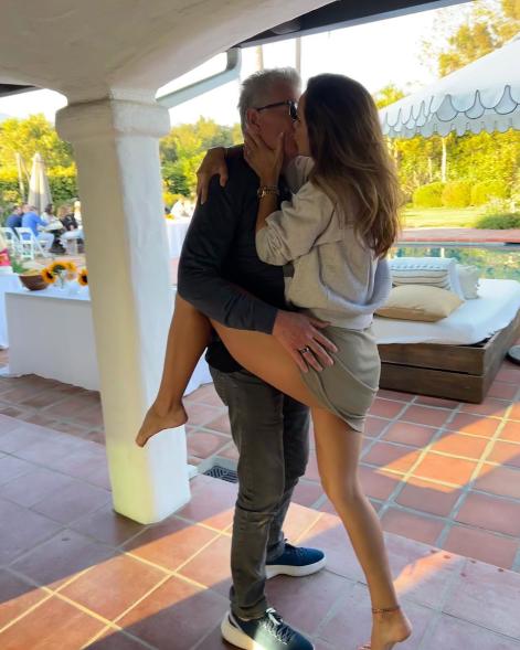 Katharine McPhee straddles David Foster in kissing picture