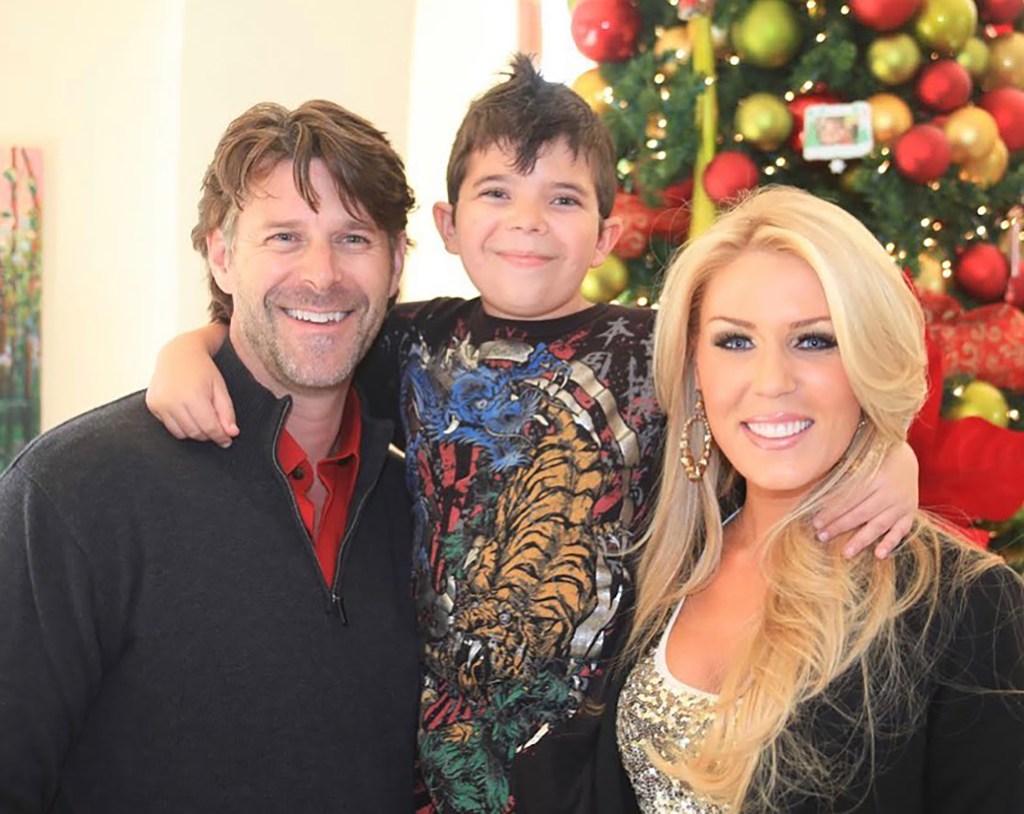 Slade Smiley and Gretchen Rossi smile in front of Christmas tree with his son Grayson