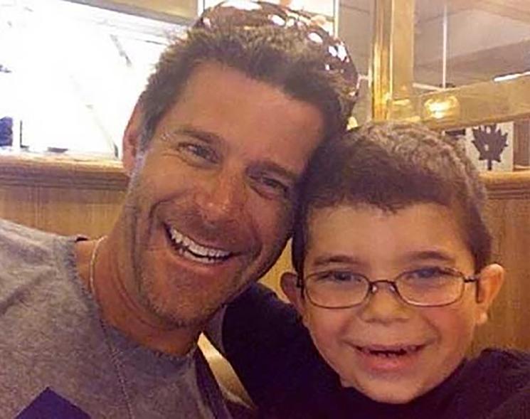 Slade Smiley smiles in photo with son Grayson in red shirt