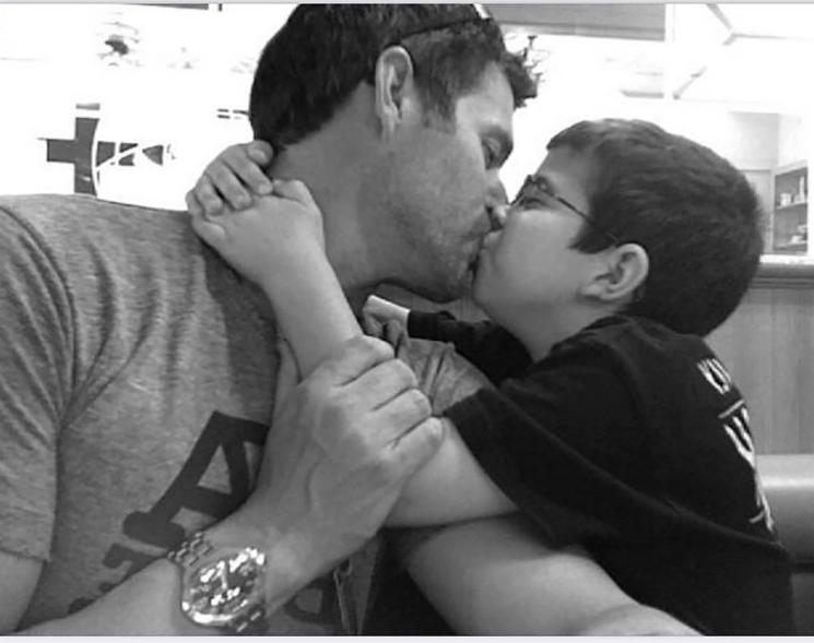 Slade Smiley kisses son Grayson in black-and-white photo