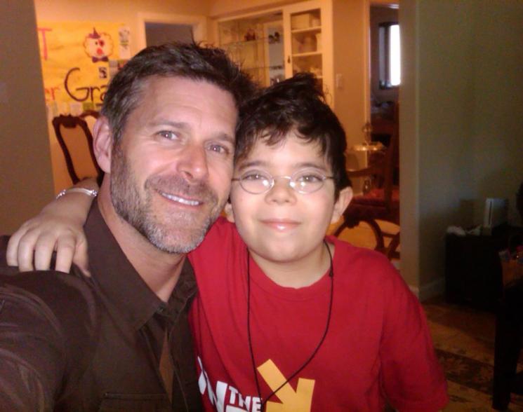 Slade Smiley smiles in photo with son Grayson in red shirt