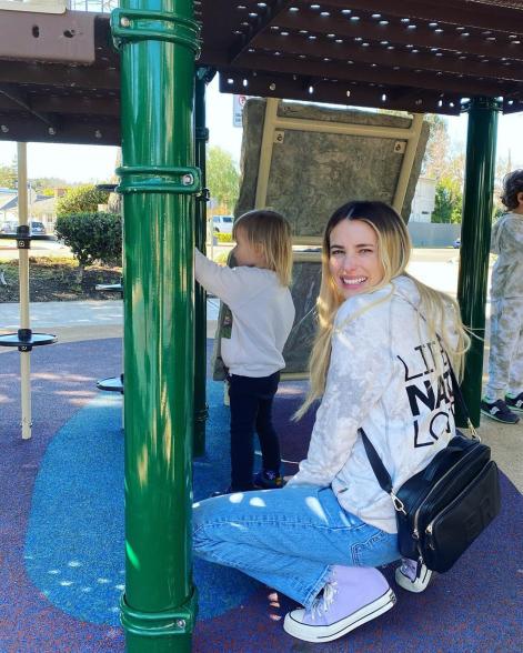 Emma Roberts smiles on playground with son Rhodes