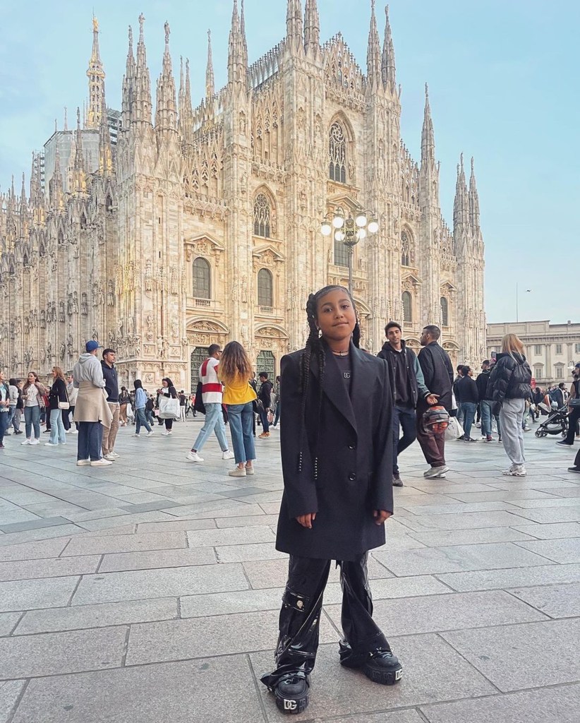 North West posing in front of a church. 