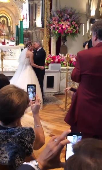 Katharine McPhee and David Foster kiss on wedding day