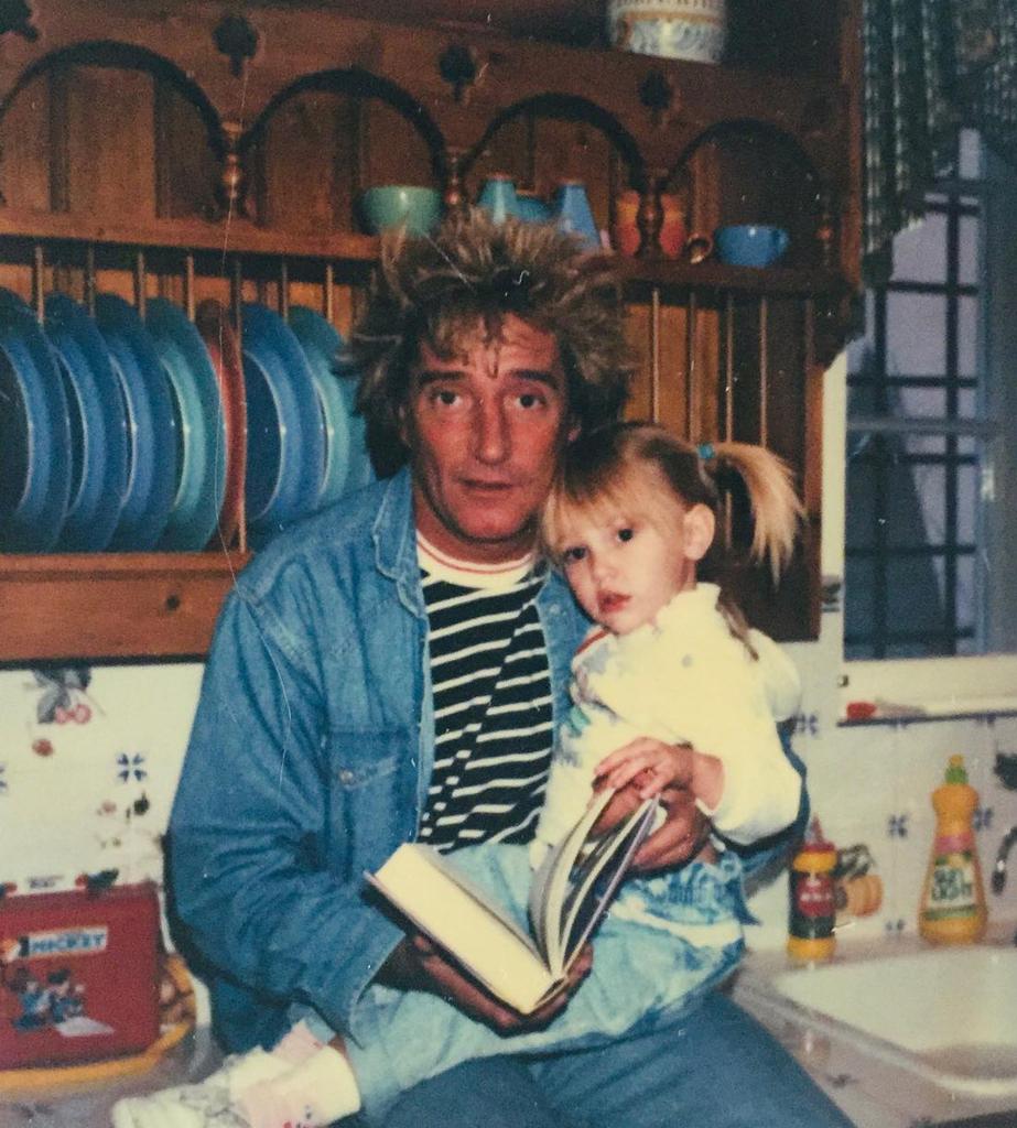 Rod Stewart holding Ruby when she was younger.