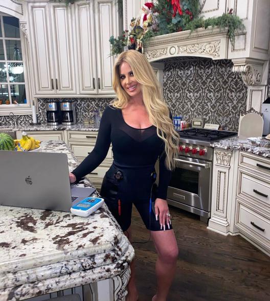 Kim Zolciak-Biermann posing in her kitchen.