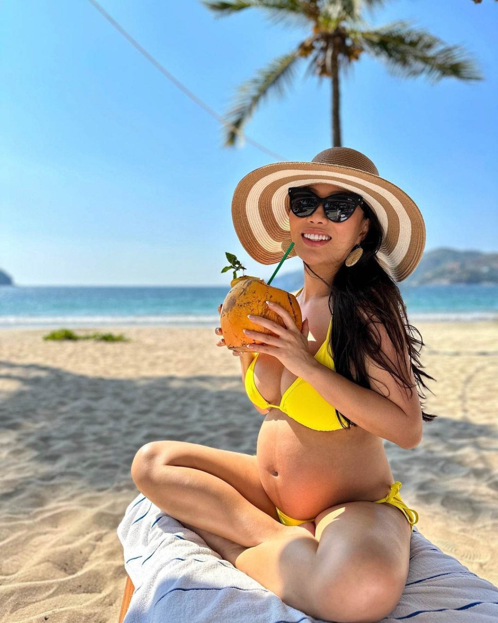 Pregnant Kelly Mi Li on the beach