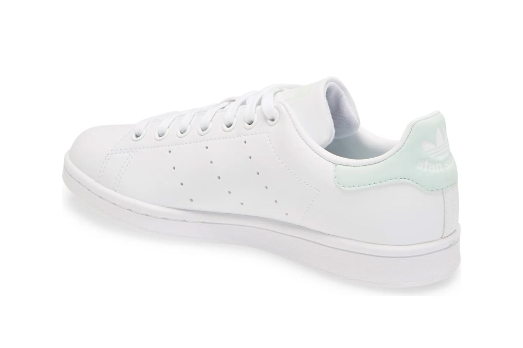 A white and teal pair of shoes