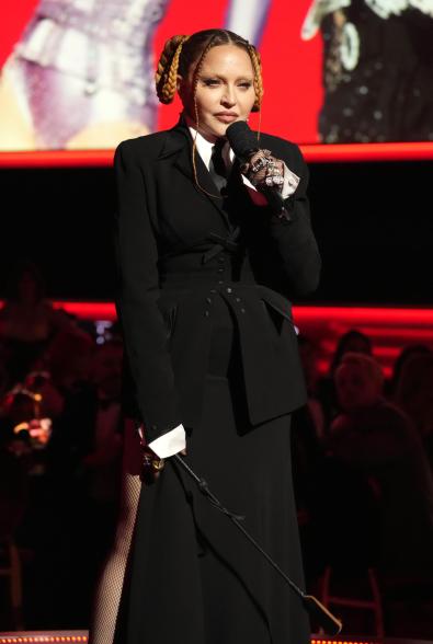 A photo of Madonna talking at the 2023 Grammy Awards