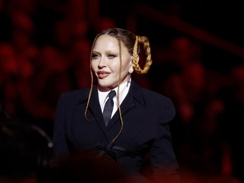 A photo of Madonna talking onstage at the 2023 Grammy Awards