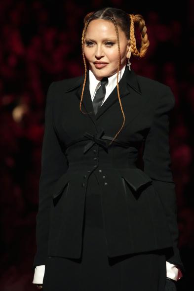 A photo of Madonna talking onstage at the 2023 Grammy Awards