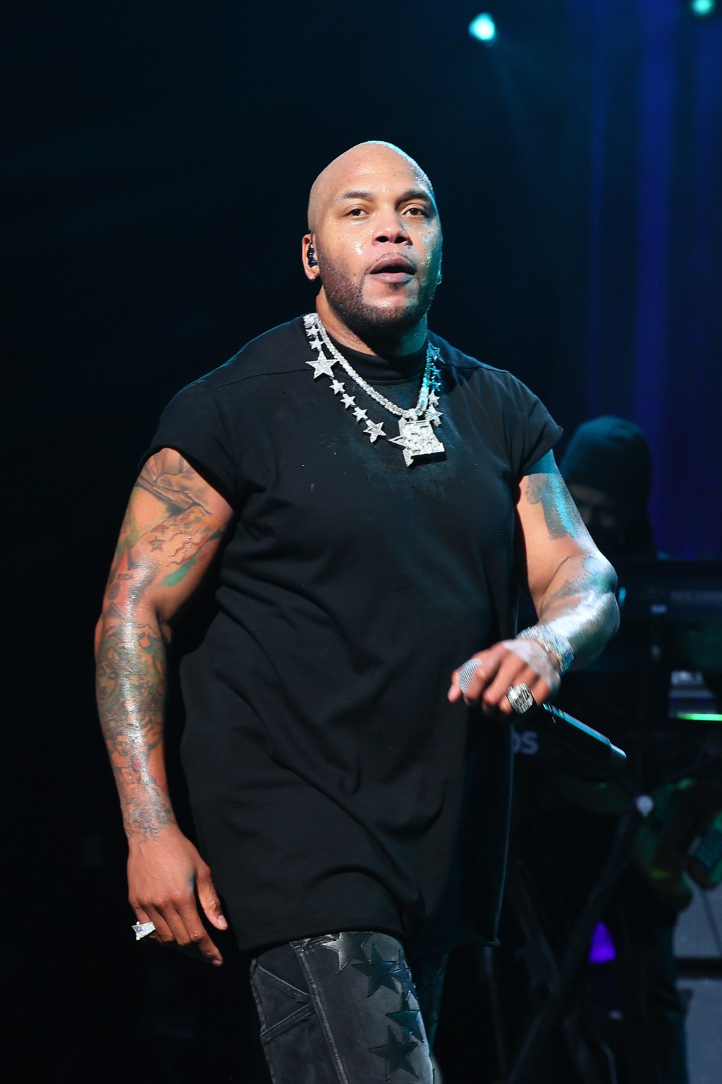 Flo Rida performing onstage.