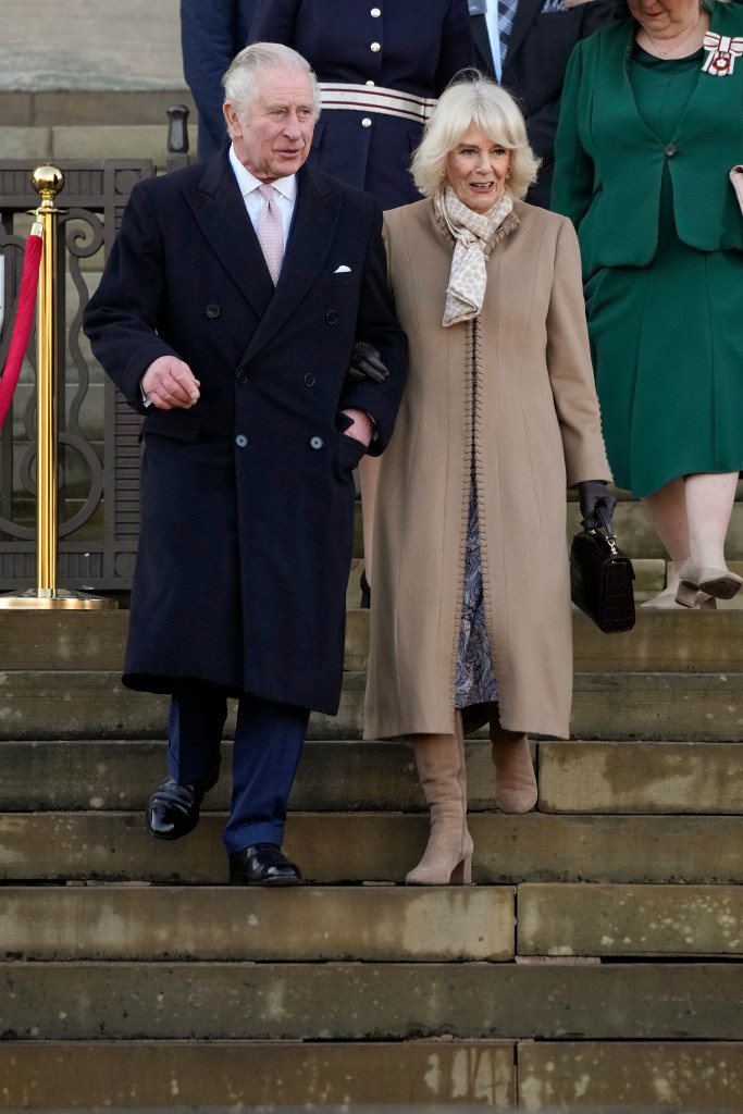 King Charles III and Queen Consort Camilla walking in England.