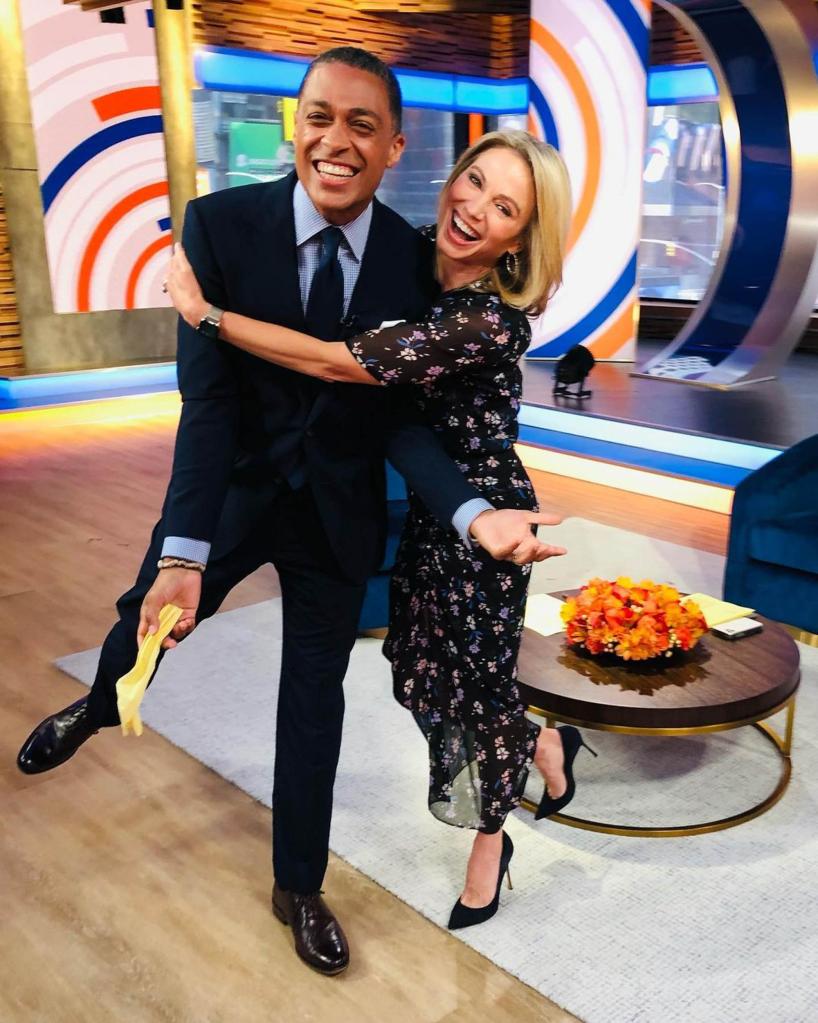 TJ Holmes and Amy Robach hugging each other