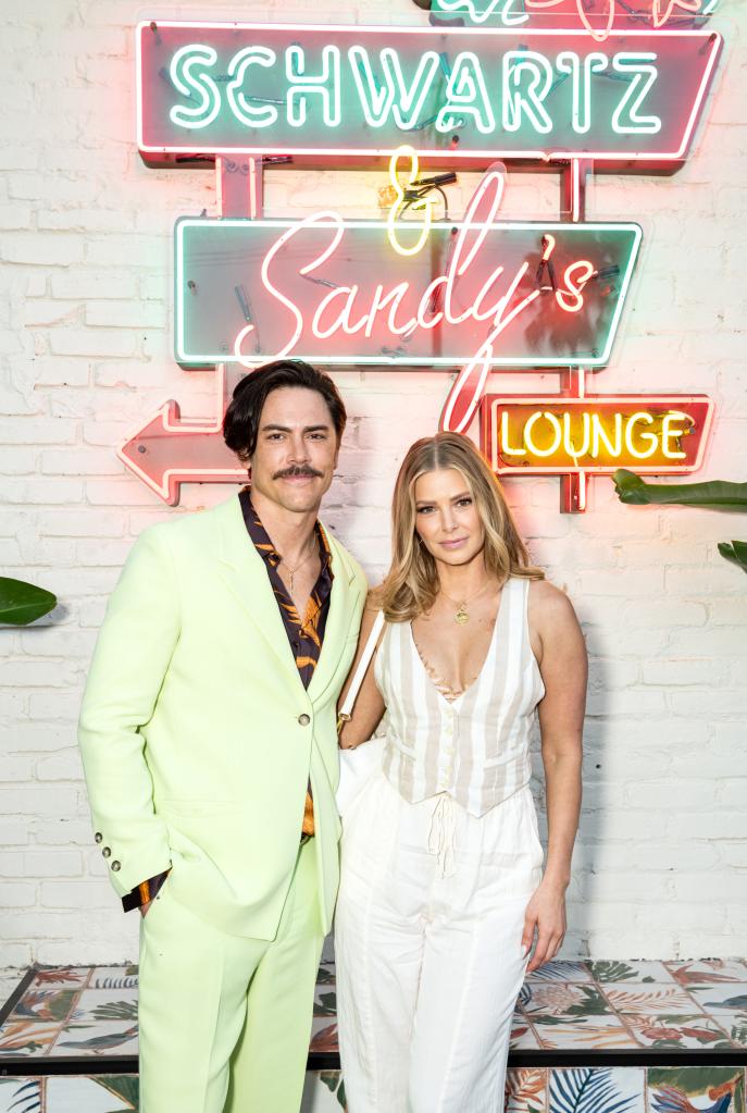 Tom Sandoval and Ariana Madix posing for a photo together at an event.