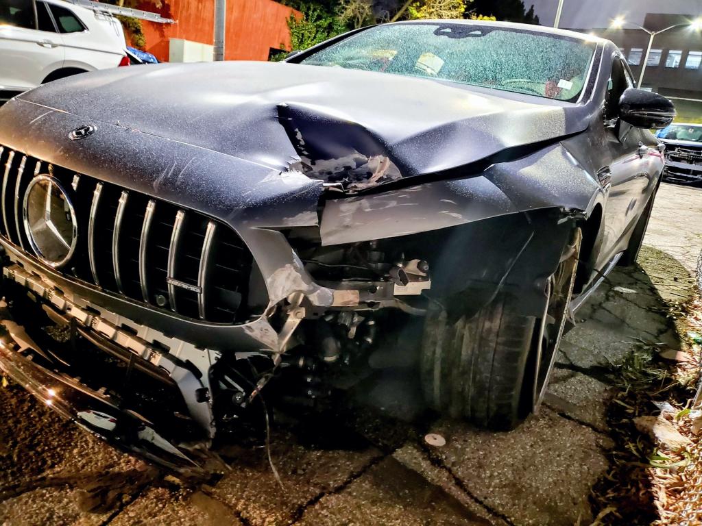 The front of a crashed Mercedes-Benz.