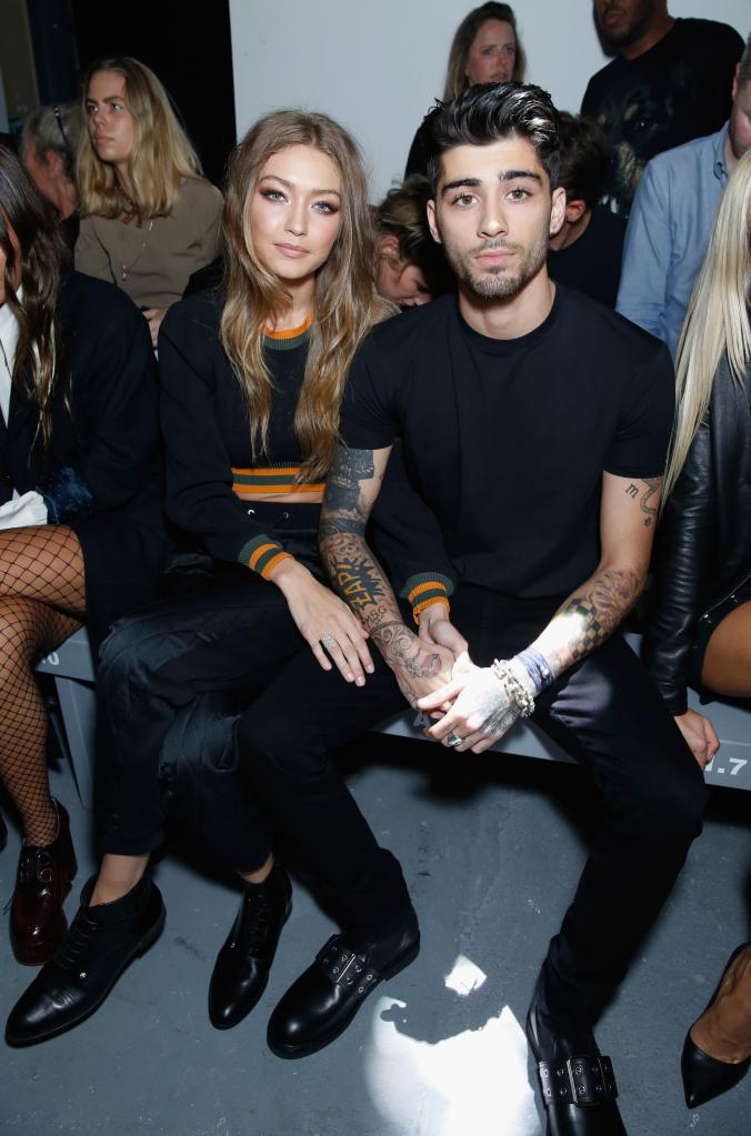 Gigi Hadid sits beside Zayn Malik in black outfits