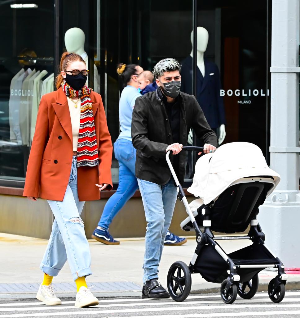 Gigi Hadi walks beside Zayn Malik as he pushes daughter Khai in stroller