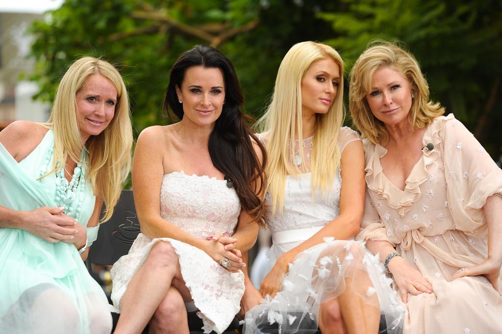 Kim Richards, Kyle Richards, Paris Hilton and Kathy Hilton posing for a picture together in 2012