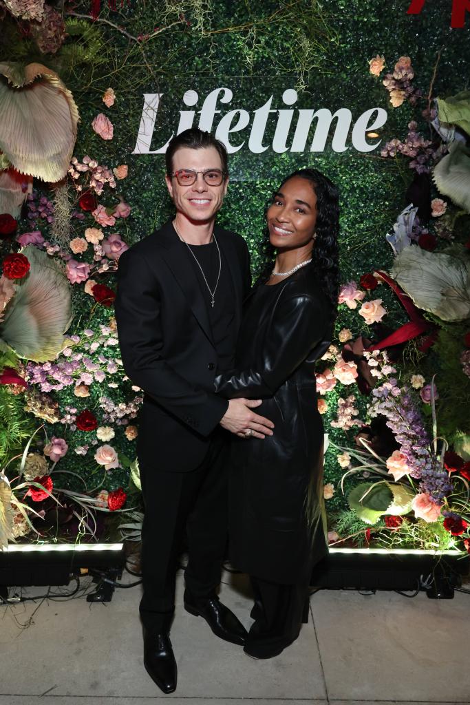 Matthew Lawrence and Rozonda "Chilli" Thomas pose in black outfits