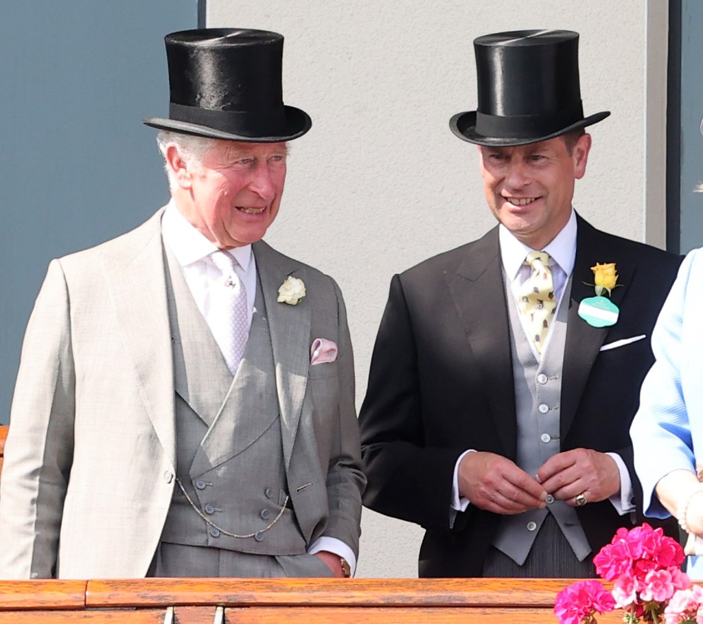 Suited King Charles III and Prince Edward match in top hats