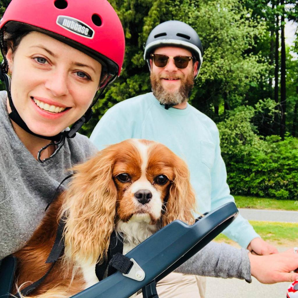 A selfie of Lauren Miller Rogen, Seth Rogen and their dog, Zelda, out for a bike ride.