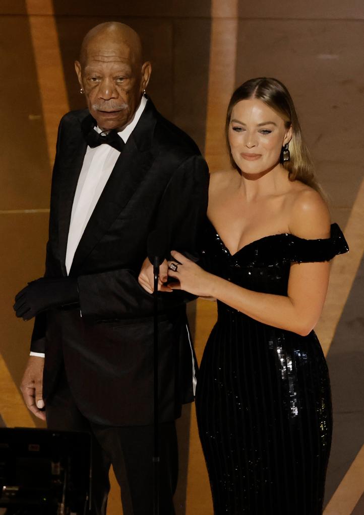 Morgan Freeman and Margot Robbie presenting onstage at the 2023 Oscars.