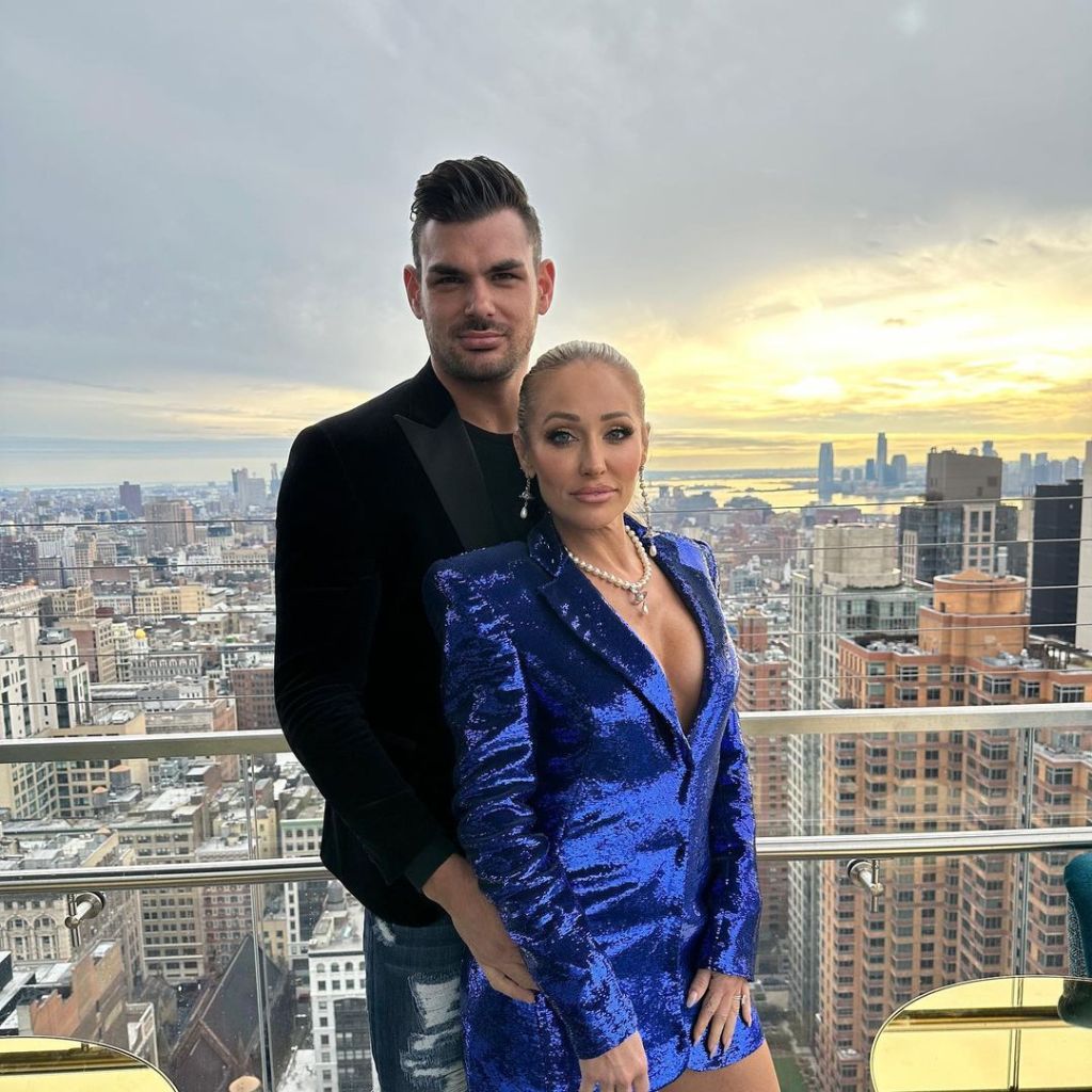 Mary Fitzgerald and Romain Bonnet posing for a rooftop photo. 