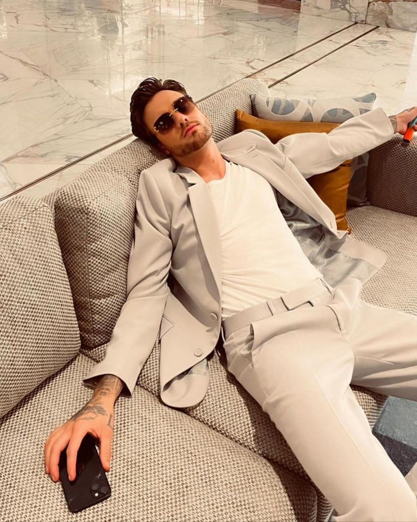 Liam Payne in a white suit.