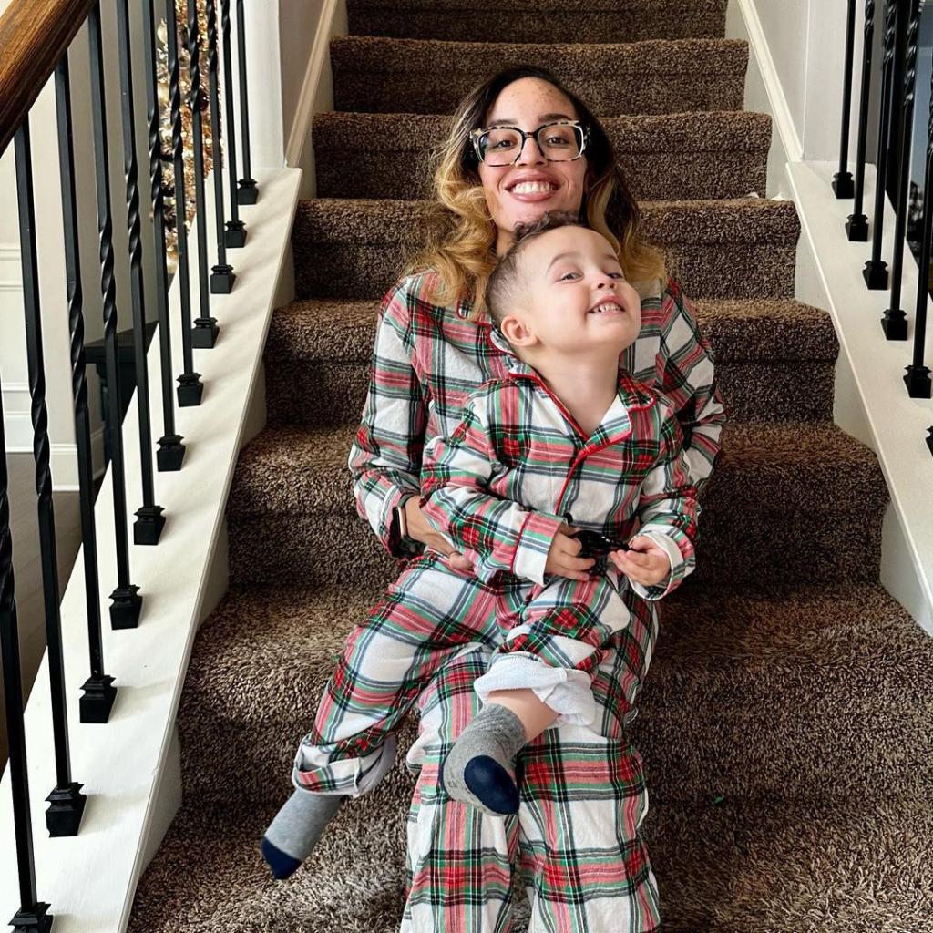 Anaston Jeni wearing matching pajamas with her son, Asher.
